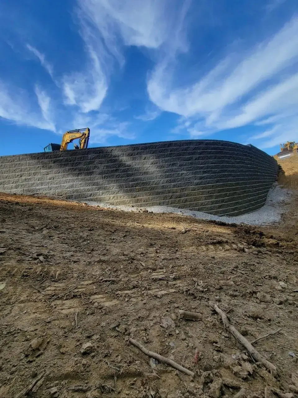Segmental block retaining wall under construction